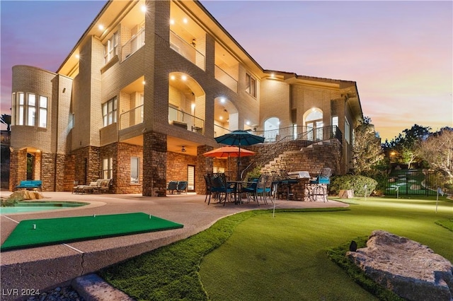 exterior space with a balcony and a patio