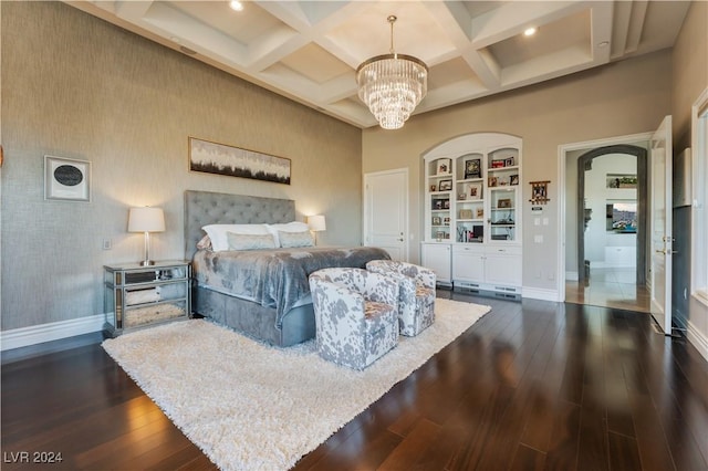 bedroom featuring coffered ceiling, an inviting chandelier, dark hardwood / wood-style flooring, and beam ceiling