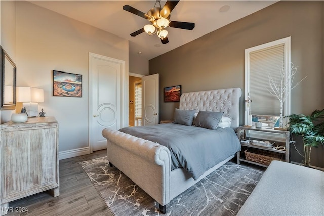 bedroom with ceiling fan and dark hardwood / wood-style floors