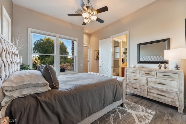 bedroom with ceiling fan, dark hardwood / wood-style floors, and ensuite bathroom