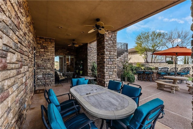 view of patio featuring ceiling fan