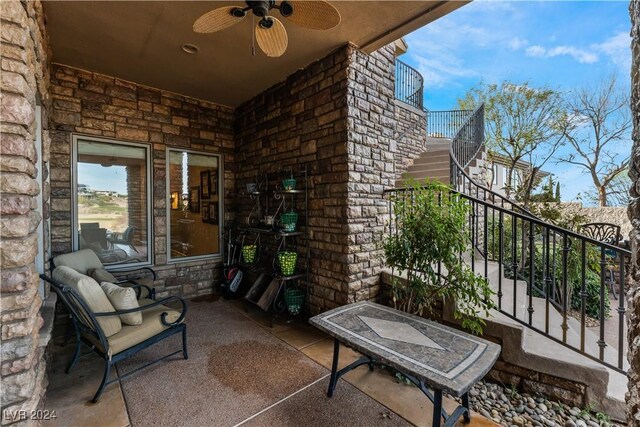 view of patio / terrace featuring a balcony and ceiling fan