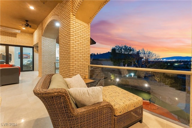 balcony at dusk featuring an outdoor hangout area