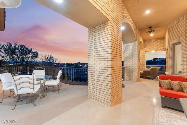 patio terrace at dusk with outdoor lounge area