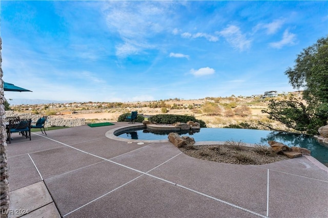 view of swimming pool featuring a patio