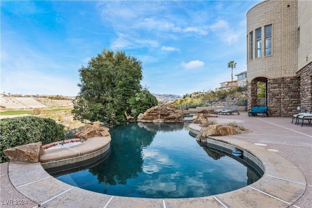 view of swimming pool with a patio area