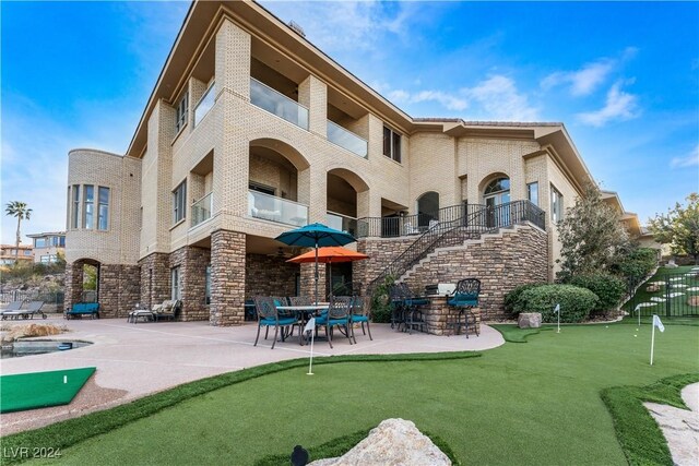 view of home's community featuring a patio