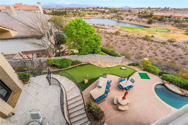 drone / aerial view featuring a water view and view of golf course