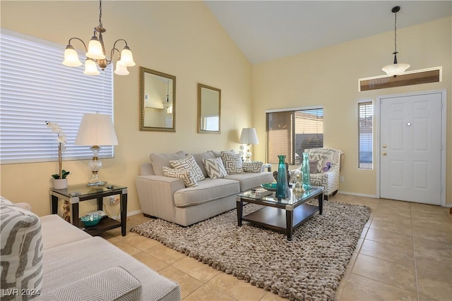 tiled living room featuring a chandelier and high vaulted ceiling