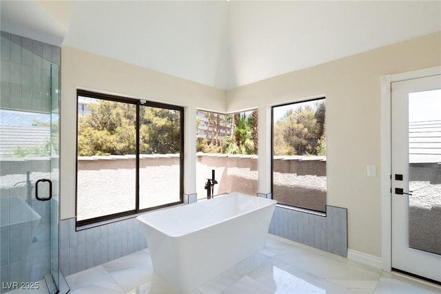 entryway featuring marble finish floor and a healthy amount of sunlight