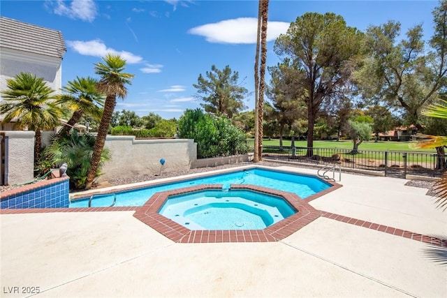 view of pool with a patio area, a fenced backyard, and a pool with connected hot tub