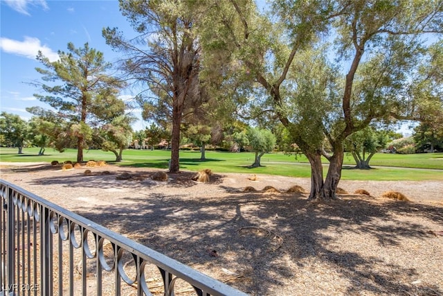 view of property's community with a lawn