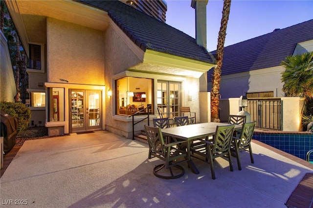 view of patio / terrace with outdoor dining space and french doors