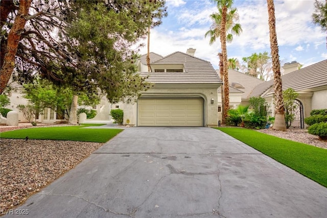 view of front facade with stucco siding, concrete driveway, a garage, a tiled roof, and a front lawn