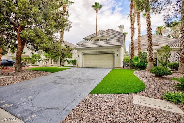 view of front of home with a garage, driveway, a tiled roof, stucco siding, and a chimney