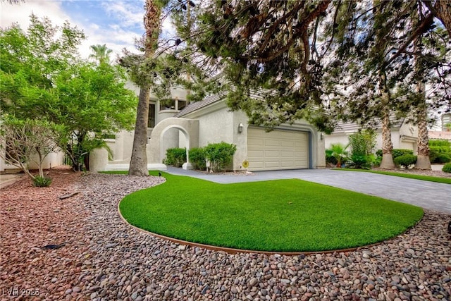 view of property hidden behind natural elements with a garage, a front yard, decorative driveway, and stucco siding