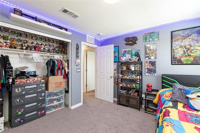 carpeted bedroom featuring a closet