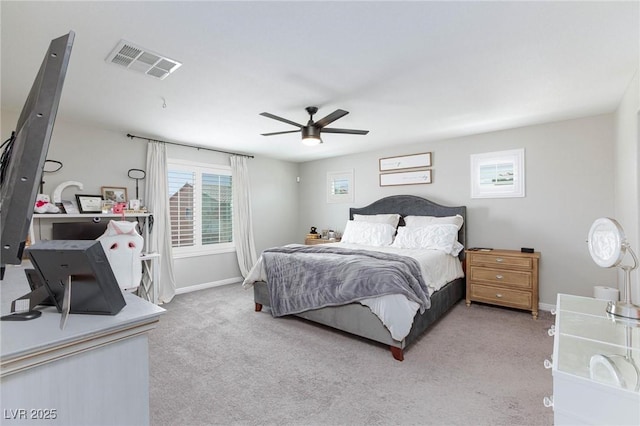 bedroom featuring light carpet and ceiling fan