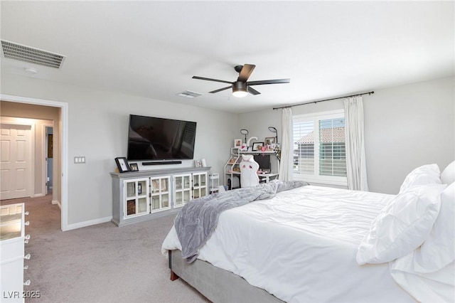 bedroom with ceiling fan and light colored carpet