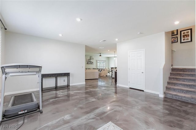 interior space with ceiling fan