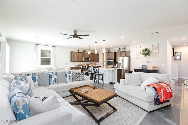 living room featuring ceiling fan