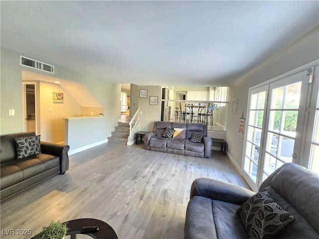 living room with light hardwood / wood-style flooring