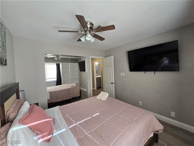 bedroom featuring ceiling fan, a closet, and wood-type flooring