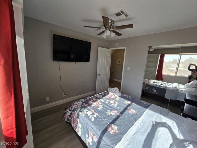 bedroom featuring ceiling fan and dark hardwood / wood-style floors