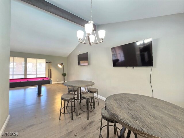 dining area with an inviting chandelier, billiards, light hardwood / wood-style flooring, and lofted ceiling with beams