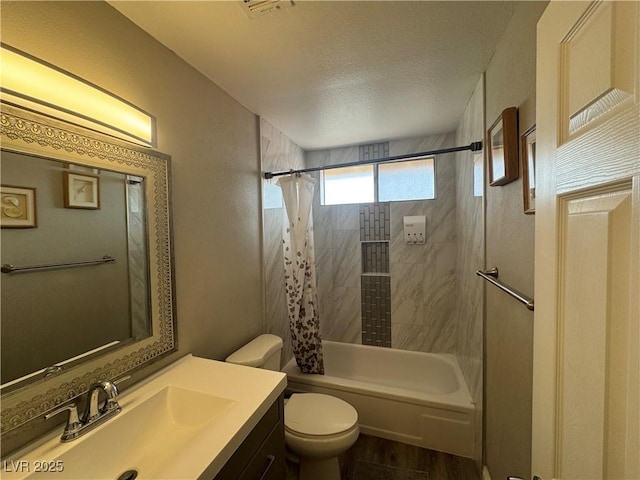 full bathroom featuring a textured ceiling, toilet, wood finished floors, shower / bathtub combination with curtain, and vanity