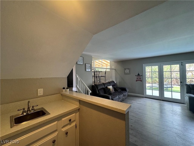 living room with dark wood finished floors and vaulted ceiling