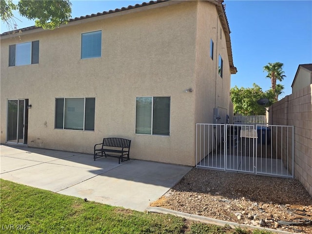 rear view of property with a patio area