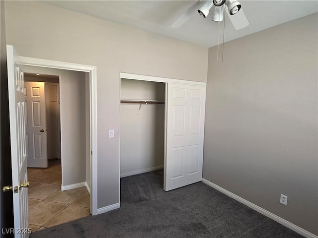 unfurnished bedroom featuring a closet, dark carpet, and ceiling fan