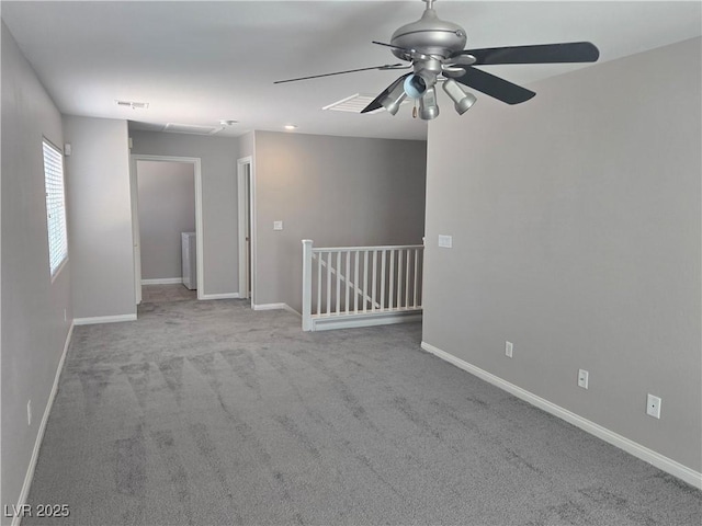 carpeted empty room with ceiling fan