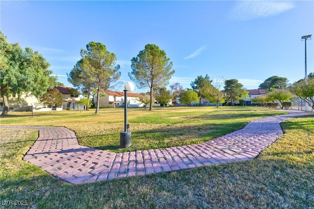 view of home's community with a lawn