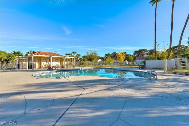 view of swimming pool with a patio