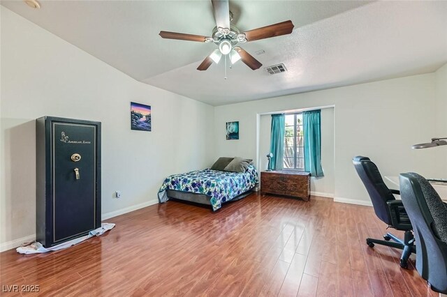 bedroom with hardwood / wood-style floors and ceiling fan