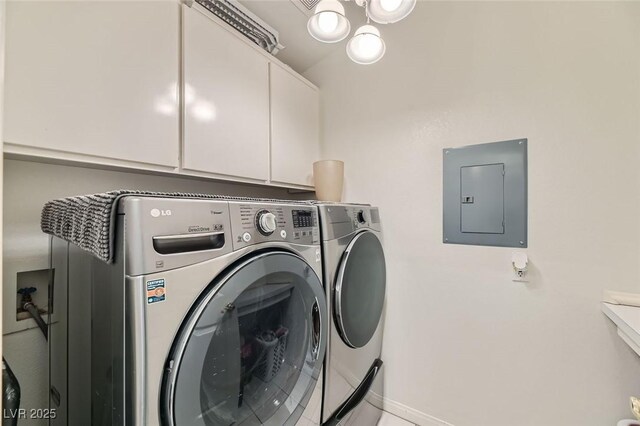 clothes washing area with cabinets, electric panel, and independent washer and dryer