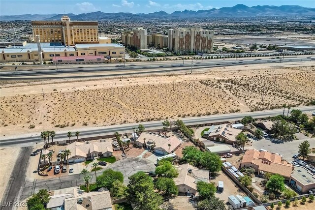 birds eye view of property with a mountain view