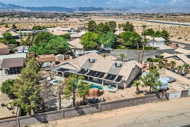 birds eye view of property with a mountain view