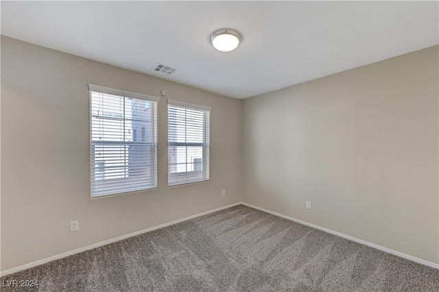 empty room featuring carpet flooring