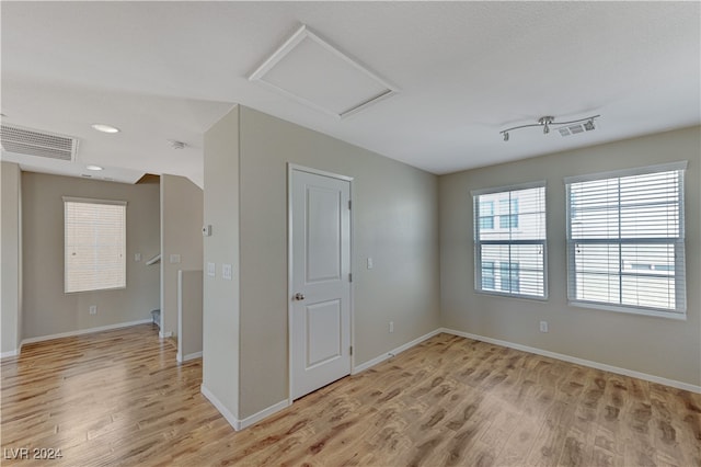 spare room with light hardwood / wood-style floors