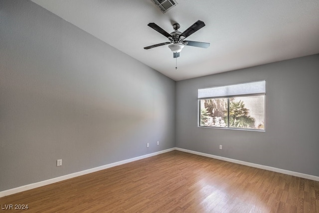 spare room featuring ceiling fan and wood-type flooring