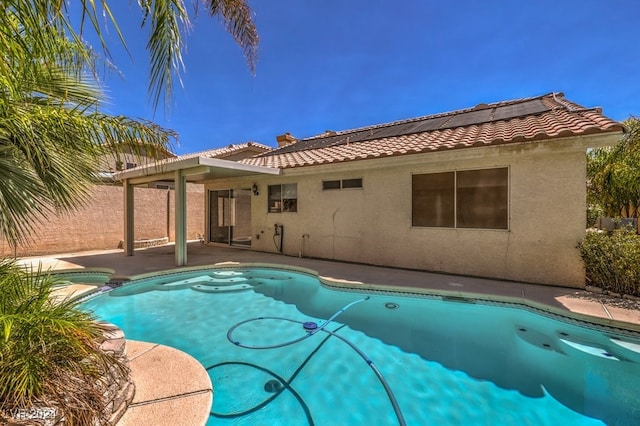 view of pool with an in ground hot tub and a patio