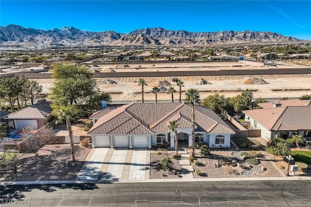 birds eye view of property with a mountain view