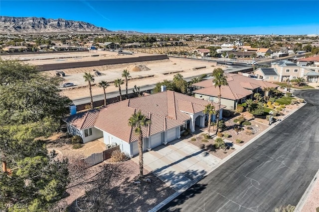 birds eye view of property with a mountain view