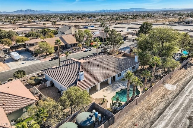 birds eye view of property with a mountain view