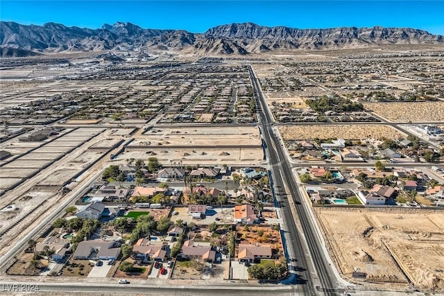 birds eye view of property featuring a mountain view