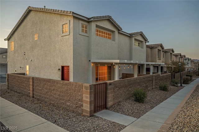 view of property exterior at dusk