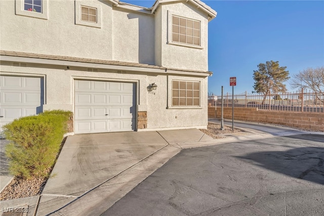 view of side of property featuring a garage